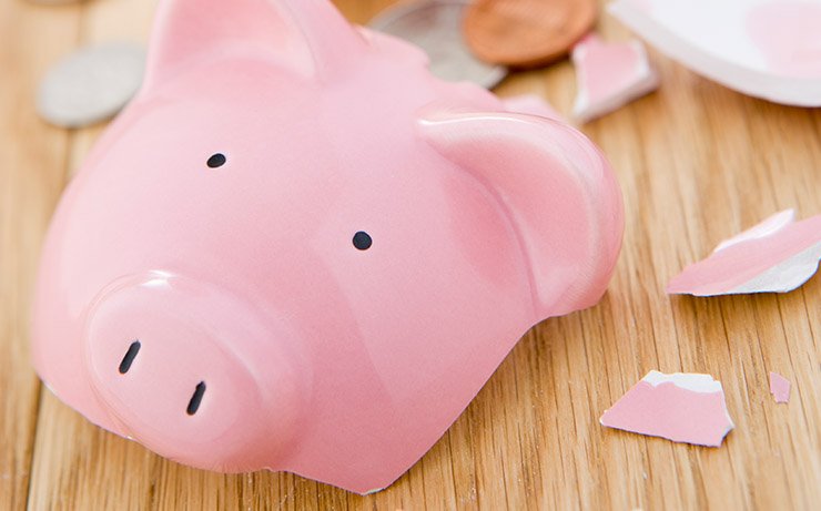 Broken Pink Piggy Bank on Wood