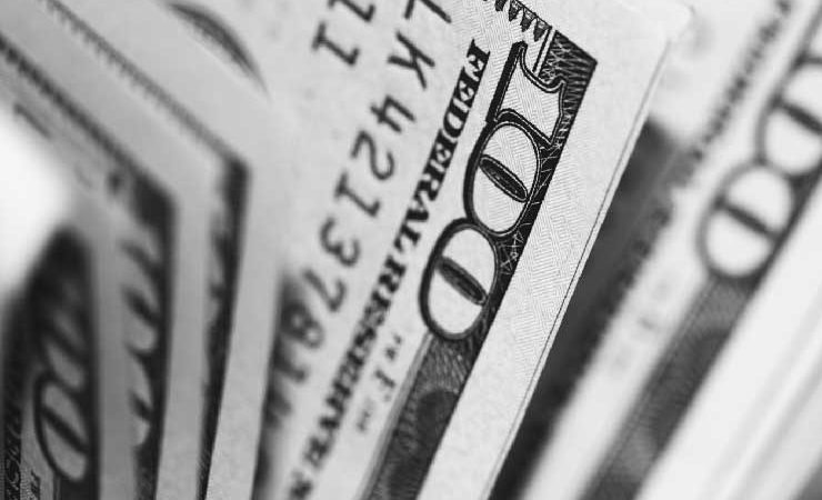 Black and white photo of 100 dollar bills close up photo