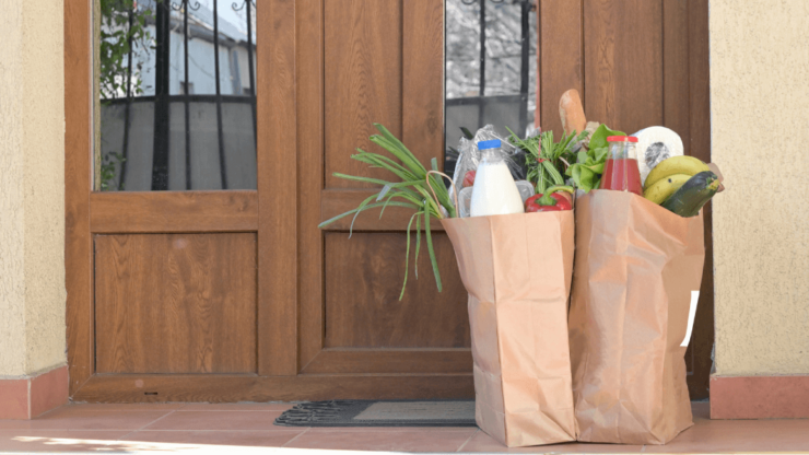 Picture of front door with grocery bags
