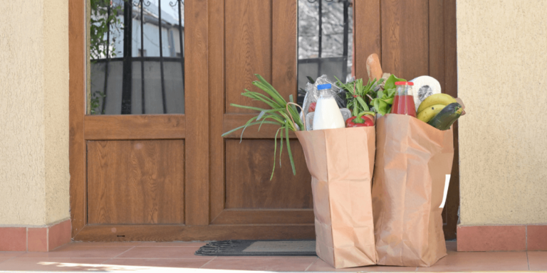 Picture of front door with grocery bags