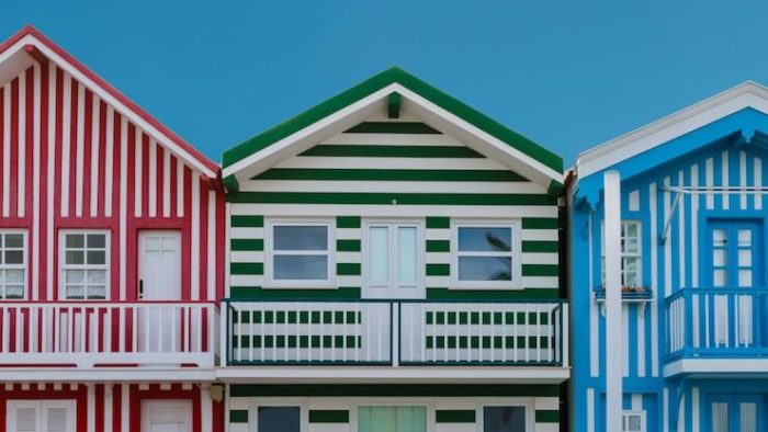 Red green and blue stripped houses that look like rental properties