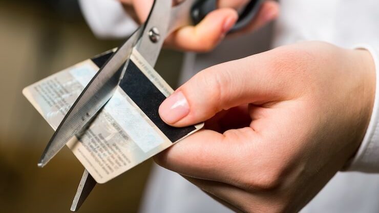 Person cutting their credit card up
