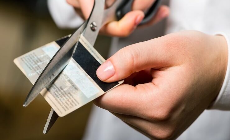 Person cutting their credit card up