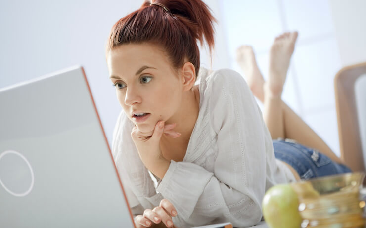 Woman surprised while looking into boglehead online