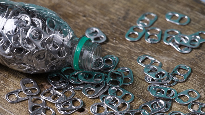 aluminum pull tabs inside plastic bottle 