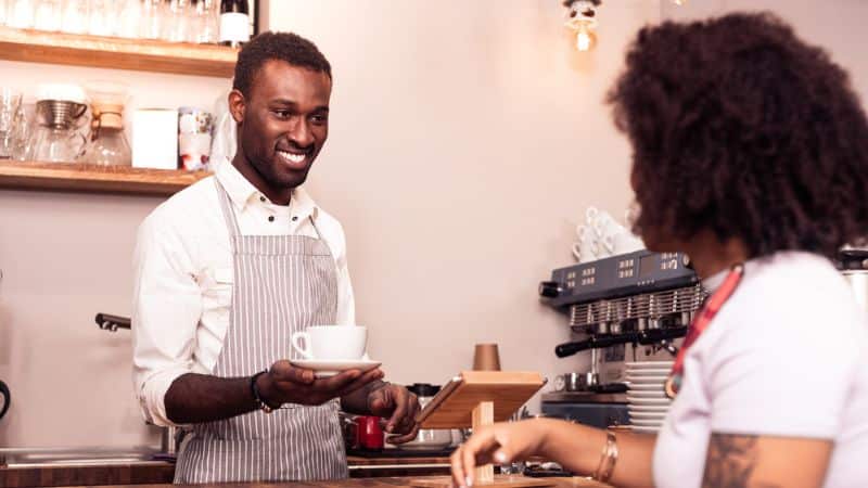 barista serving coffee