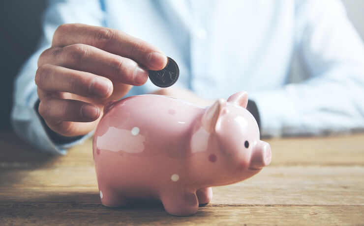 man putting money into bank investment