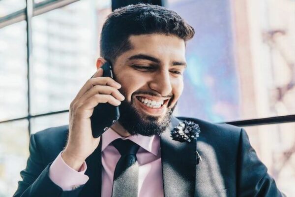 man using phone with 800 business