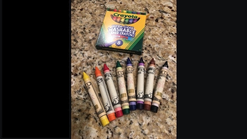 crayons wrapped with money