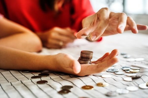 Couple counting coins to invest