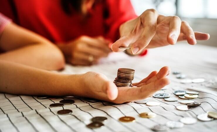 Couple counting coins to invest