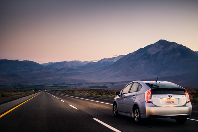 toyota prius driving on the road