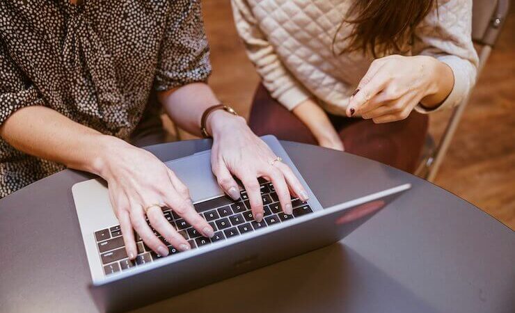 Women evaluating search engines on their computer to make money