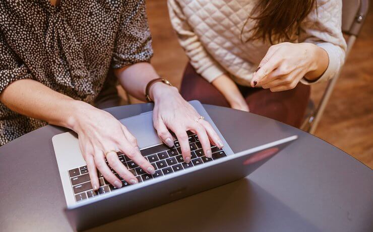 Women evaluating search engines on their computer to make money