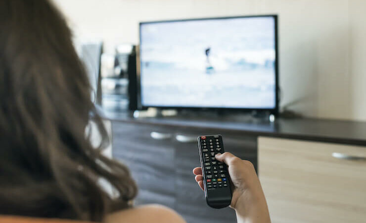 Woman Watching TV at home